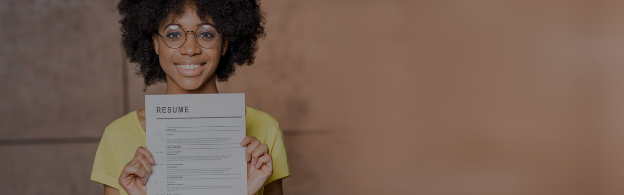 Woman holding up a resume